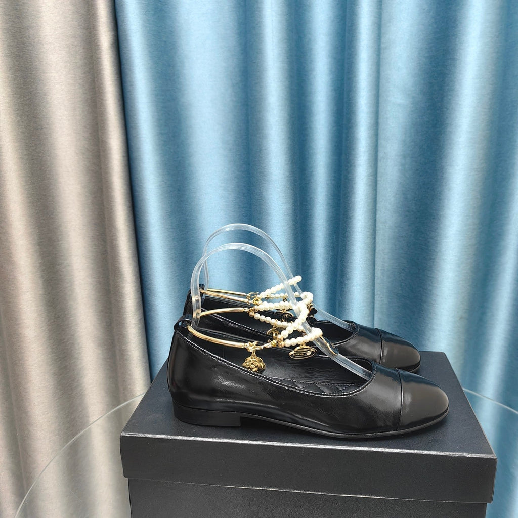 CHANEL MARY JANE WITH PEARL STRAP IN GLOSSY BLACK LAMBSKIN